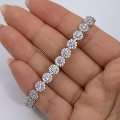 7mm Round-Cut CZ Flower Tennis Bracelet Sterling Silver 925 * Metal : Real Sterling Silver (Properly Stamped, 925) * Condition : Brand New * Finish : Polished * Average Weight : 15.34 grams * Length : 7.25" * Width : 7mm = Just over 1/4" * Clasp/Bail : Figure 8 Safety Clasp All of our items are brand new and are shipped with a gift box. New York Las Vegas, Bracelet Tennis, Average Weight, Figure 8, Fine Jewelry Bracelets, Jewelry Business, Bracelets And Charms, Tennis Bracelet, Buying Jewelry