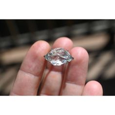 a person holding a diamond in their hand