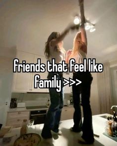 two women dancing in a kitchen with the words friends that feel like family > >