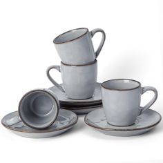 a set of four cups and saucers