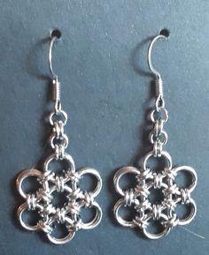 handmade stainless steel chainmaille earrings.  One of a kind.  Unique. Medieval Style Silver Earrings For Gift, Medieval Style Handmade Earrings For Gift, Medieval Style Nickel-free Silver Earrings, Handmade Silver Steampunk Earrings, Handmade Gothic Sterling Silver Earrings, Steampunk Silver Metal Earrings, Steampunk Silver Earrings, Steampunk Style Silver Metal Earrings, Handmade Medieval Metal Earrings