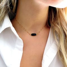 "This dainty little black onyx choker is edgy, feminine and delicate - you'll love it! Available in 14k gold filled and sterling silver. Shop Landon Lacey Jewelry: www.landonlacey.com it's in the DETAILS . . . - Genuine black onyx pendant - 14k gold filled or sterling silver bar chain - Spring ring clasp it's in the OPTIONS . . . - Select your length. If you want this to sit like a choker, please measure your neck! The model is wearing this necklace at 14\", but neck sizes vary. it's in the DELI Gold And Black Necklace, Black Choker With Adjustable Chain As Gift, Minimalist Black Choker As A Gift, Black Onyx Choker Jewelry, Adjustable Onyx Choker Necklace, Adjustable Dainty Black Choker, Elegant Onyx Choker Jewelry, Black Adjustable Necklaces With Delicate Chain, Minimalist Black Choker Jewelry