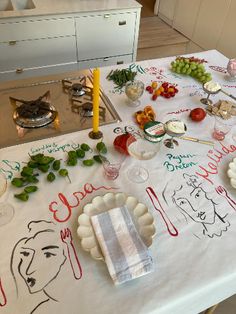 the table is covered with many different types of food