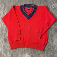 Vintage 2000s Gap Basic Essential Streetwear Causal Preppy Style Y2K Aesthetic Red Pullover V Neck Knit Sweater Extra Large Mens Condition:  Excellent Used Condition  = No Flaws Measurements: Please see photos above for all measurements IF YOU BUY TWO OR MORE ITEMS USE THE CODE BUNDLE @ CHECK TO SAVE 20% WE SHIP WITHIN 24 HOURS AFTER PURCHASE! Please be aware that we do not offer free returns!! The Buyer is responsible for the cost of the return label.  Follow us on TikTok & Instagram @findsnost Y2k V-neck Sweater For Fall, Red Knit Tops With Ribbed Cuffs, Y2k Style V-neck Sweater For Fall, Y2k V-neck Fall Sweater, Red Long Sleeve Polo Sweater For Winter, Retro Red Top With Ribbed Cuffs, Casual Red Polo Sweater For Winter, Red Long Sleeve Sweater For Streetwear, Winter V-neck Sweater For Streetwear