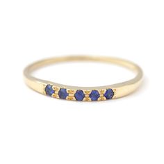 Dainty sapphire ring with five 1.5 mm blue sapphires in 18k soild gold. Can be a beautiful alternative wedding band. Materials: 18k solid gold, five 1.5 mm royal blue sapphires ► Choose your gold color > yellow gold / white gold / rose gold This design is also available with: ► Emeralds: https://www.etsy.com/il-en/listing/222378844 ► Rubies: https://www.etsy.com/il-en/listing/222379810 ► Turquoise: https://www.etsy.com/il-en/listing/180505967 ► Black diamonds: https://www.etsy.com/il-en/listi Blue Sapphire Half Eternity Ring For Promise, Blue Sapphire Half Eternity Ring As Gift, Blue Sapphire Ring With Half Eternity For Gift, Blue Sapphire Promise Ring With Half Eternity, Yellow Gold Stackable Sapphire Ring, 14k Gold Sapphire Half Eternity Ring, Yellow Gold Sapphire Diamond Promise Ring, Blue Sapphire Stackable Birthstone Ring, Blue 14k Gold Stackable Promise Rings