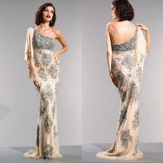 a woman in an evening gown with one shoulder open and the other closed, looking back