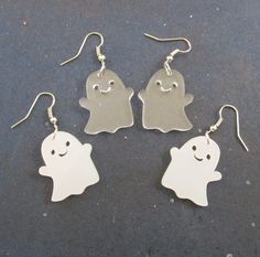 Happy Kawaii Halloween Ghost Dangle Holiday Earrings in White or Clear by… Handmade White Plastic Earrings, White Kawaii Earrings For Party, White Kawaii Jewelry For Party, Kawaii White Party Jewelry, Fun White Hypoallergenic Earrings, Fun White Halloween Earrings, Cute White Plastic Jewelry, Fun White Halloween Jewelry, Fun White Jewelry For Halloween