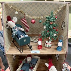 an open suitcase with christmas decorations on it