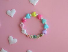 Personalized Kids Bracelet with Colorful Heart-Shaped Spacer Beads 🌈 Brighten Up Their Day with a Touch of Love 🌈 Introduce your little one to the world of fun and fashion with our Personalized Kids Bracelet, adorned with vibrant heart-shaped spacer beads. This playful accessory is perfect for adding a splash of color and joy to any outfit. 💖 Colorful Heart-Shaped Spacer Beads 💖 Each bracelet is crafted with a delightful assortment of colorful heart-shaped beads, making it a cheerful and eye Cute Name Bracelet With Round Beads For Birthday, Cute Heart Bracelet With Round Beads For Valentine's Day, Multicolor Friendship Bracelets For Birthday And Valentine's Day, Multicolor Bracelets For Birthday And Valentine's Day, Cute Letter Beads Stretch Bracelet For Valentine's Day, Cute Stretch Bracelet With Letter Beads For Valentine's Day, Cute Heart Beads Beaded Bracelets For Valentine's Day, Cute Heart Beaded Bracelets For Valentine's Day, Cute Heart-shaped Beaded Bracelets For Valentine's Day