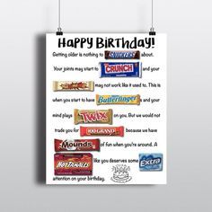 a happy birthday poster hanging on a wall with candy bars and candies in it