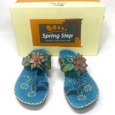 Features: Slogan: Comfort With Every Step Leather Toe Divider/Thong Sandal Gives Your Casual Attire A Unique Edge Hand Painted Leather Upper Instep Velcro Strap With Hook And Loop Closure Beautiful Floral Design And Embellishments With Ornament Accent Comfort Cushioned Footbed Molded Wedge Heel Comes With Original Box Spring/Summer/Floral/Embellishment/Comfortable/Walking Sandal/Slip On Size: 36 / 6 (Us) Condition: Pre-Owned; Excellent Condition; No Flaws Noted; Nwot Ship Same Or Next Business D Turquoise Sandals With Removable Insole For Beach, Turquoise Beach Sandals With Removable Insole, Adjustable Light Blue Sandals For Spring, Bohemian Blue Closed Toe Sandals, Closed Toe Turquoise Sandals For Summer, Turquoise Closed Toe Sandals For Summer, Blue Bohemian Sandals For Spring, Blue Leather Sandals For Spring, Blue Leather Spring Sandals