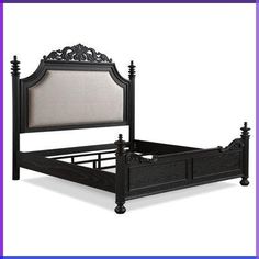 a black bed frame with an ornate headboard and foot board on the bottom side