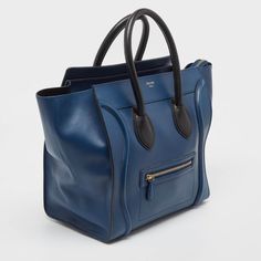 CELINE Navy Blue/Black Leather Mini Luggage Tote  This alluring tote bag for women has been designed to assist you on any day. Convenient to carry and fashionably designed, the tote is cut with skill and sewn into a great shape. It is well equipped to be a reliable accessory.   Size: Height: 30.5 cm, Width: 17 cm, Length: 30.5 cm  Material: Leather  This item has been used and may have some minor flaws. Before purchasing, please refer to the images for the exact condition of the item.   A return request must be submitted within 48 hours after delivery. Customer is responsible for return shipping costs and fees. Estimated return shipping costs for this item are $80. Contact Our Customer Support for details.  This item ships internationally and will ship out within 3-5 business days.  We can Mini Luggage, Celine Luggage, It Is Well, Diaper Backpack, Shopping Tote, Bag For Women, Baby Bag, Leather Mini, Luxury Bags