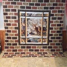 a brick fireplace with deer on it in a living room