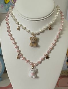 Teddy bear charm necklaces made with plastic beads. About 18 inches stretch cord necklaces. teddy pearls beaded kawaii cute aesthetic charms stars Easter basket gift Cheap Charm Necklaces With Beaded Chain And Round Beads, Cute Accessories Necklaces, Pearl Necklace With Charm, Kawaii White Beaded Jewelry, Cute Handmade White Charm Necklaces, Cute Beaded Charm Necklaces For Gifts, Cute Beaded Charm Necklace As Gift, Cute White Pearl Necklace, Cute Beaded Charm Necklaces