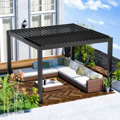 an outdoor living area with couches and plants