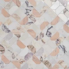 a white and pink marble mosaic tile wall