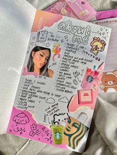 an open notebook with stickers and pictures on the pages, along with other items