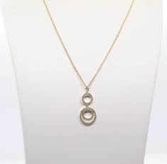 The Gold Loop Necklace is a beautiful piece of jewelry that features double round CZ pendants. It's sure to become a favorite! The necklace is available in a variety of lengths, so you can find the perfect fit. It's also available in a variety of finishes, so you can choose the one that best suits your personal style. Formal Round Pendant Necklace, Formal Round Pendant Chain Necklace, Formal Round Pendant Necklace With Chain, Elegant Long Necklace With Round Pendant For Gift, Round Diamond Necklace With Chain For Gift, Diamond Necklace Gift With Chain, Round Diamond Necklace Gift With Chain, Round Long Chain Necklace For Gift, Elegant Round Charm Necklace