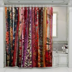 the shower curtain has many different colored fabrics on it