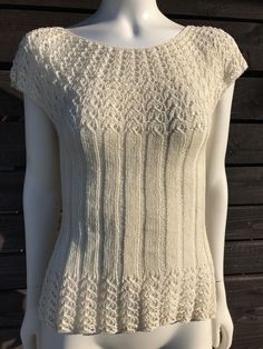 This is a vintage handmade ivory blouse from the 1990s, knitted in several different patterns. The front and the hem of the blouse are slightly sheer, which gives it a special charm. The blouse is very stretchy and elastic.  The material is breathable, permeable and healthy for the body. In addition, the blouse looks very impressive. Wear it everywhere, whether it's to a party or to work. Material: linen and cotton blend. Size: (I think best for)  EUR 38 / UK 10 The M - Medium Also check the mea Beige Crochet Top With Crew Neck And Knit Fabrication, Fitted Cream Crew Neck Knit Top, Beige Crochet Top With Crew Neck, White Crochet Knit Top, Off White Textured Knit Crew Neck Top, Cream Pointelle Knit Crew Neck Top, Fitted Textured Knit Crochet Top Crew Neck, Classic Beige Pointelle Knit Tops, Fitted Textured Knit Cream Crochet Top