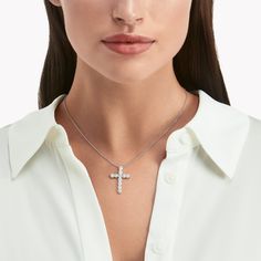 A precious interpretation of a classic motif, our medium cross pendant in white gold is available in a variety of different carat weights, seen here with 0.15 carat diamonds. Deftly suspended from a white gold chain, each diamond is embraced by a minimal metal setting, optimising their brilliance and presence. The Classic Graff collection celebrates the purity and fire of the finest Graff diamonds showcased in truly timeless jewels and eternally elegant silhouettes. A precious interpretation of Elegant Sterling Silver Cross Necklace, Elegant Silver Cross Necklace, Elegant Brilliant Cut Cross Pendant Necklace, Elegant White Cross Necklace Pendant, Elegant White Cross Pendant Necklace, Elegant White Pendant Cross Necklace, Elegant White Crucifix Necklace, White Diamond Cross Necklace With Brilliant Cut, Elegant Diamond White Cross Necklace With Diamond Accents