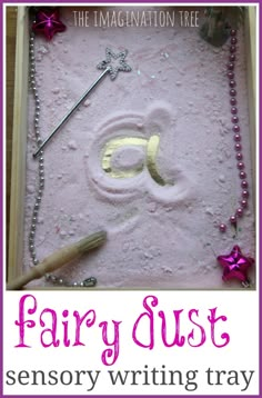 the fairy dust writing tray is filled with letters and beads