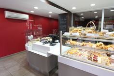 a bakery filled with lots of different types of pastries and desserts on display