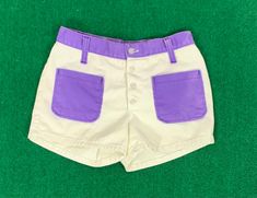 "B E S T  F I T S  Suggested Size: 0/2  Please check measurements below to ensure the best possible fit.    D  E  S  C  R I  P  T  I  O  N    *Beige and purple denim short shorts  *Button up front  *Two front pockets  *Belt loops  *3\" Inseam  *There is no stretch to the item  *1970s  era    D  E  T  A  I  L  S    * Fabric:  No label - cotton denim  * Care: Machine wash  * Marked Size: 7  * Maker's Label: Sears Jr. Bazaar     M  E  A  S  U  R  E  M  E  N  T  S    (Measurements are taken flat acr Purple Denim, Denim Short Shorts, Time Travelers, Pocket Belt, Cool Jackets, Denim Short, Short Shorts, Summer Shorts, Gorgeous Dresses