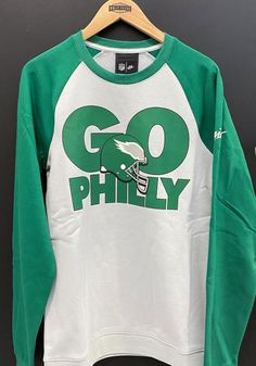 Nike Philadelphia Eagles Mens Grey Go Helmet Historic Raglan Long Sleeve Fashion Sweatshirt - 17320931 Long Sleeve T-shirt With Team Logo For Streetwear, Long Sleeve Team Logo T-shirt For Streetwear, Throwback Long Sleeve T-shirt For Sports Events, Throwback Long Sleeve Tops With Team Logo, Team-colored Crew Tops For Streetwear, Varsity Long Sleeve T-shirt For Fan Merchandise, Long Sleeve Varsity T-shirt For Fans, Throwback Team Logo Long Sleeve Sweatshirt, Varsity Long Sleeve T-shirt With Team Logo