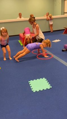 children playing with toys in an indoor gym