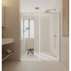 a bathroom with a walk in shower sitting next to a sink and mirror on the wall