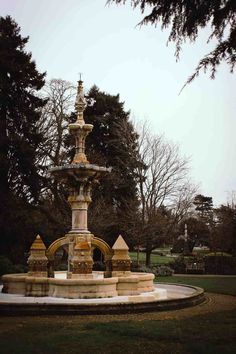 a fountain in the middle of a park