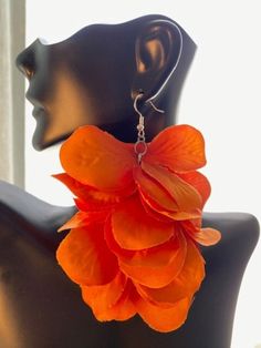 Fashion alert! Beautiful orange earrings are ready to change your life! Do you have a basic orange top and you need to accessorize? These earrings are a fashion statement by themselves! Lightweight, long and ready to make an appearance! You can even get any solid color dress and spice up your wardrobe with these earrings. Please note, these are handmade (with love) so they may be slightly different than the photo. Summer Orange Flower-shaped Jewelry, Orange Flower Shaped Earrings For Party, Elegant Orange Flower Earrings, Orange Flower Shaped Earrings For Summer, Orange Flower Earrings For Gift, Orange Flower-shaped Earrings For Gift, Orange Flower-shaped Earrings For Summer, Orange Flower Earrings For Party, Orange Dangle Flower Earrings For Gift