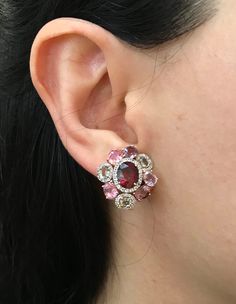 A Statement Earring handcrafted in Rose Gold Plated over Sterling Silver features a center Garnet embellished with Multi-color Spinel and Tourmaline and Halo Diamonds. A stunning, jaw-dropping stud earrings that makes a commanding statement earrings.(e-c-63) Earring measure 9mm x 20mm *LIKE* us on Facebook http://www.facebook.com/Belesas to get 10%off coupon code, *FOLLOW* us on Twitter https://twitter.com/#!/Belesas to get more exclusive coupon codes *All item are ready to ship! Free shipping o Multicolor Diamond Gemstone Earrings, Unique Multi-stone Earrings For Formal Occasions, Fusion Multi-stone Pink Jewelry, Luxury Pink Multi-stone Earrings, Elegant Red Multi-stone Earrings, Unique Formal Multi-stone Earrings, Multicolor Gemstone Accented Earrings For Formal Occasions, Pink Oval Ruby Earrings, Elegant Multicolor Oval Earrings