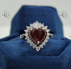 Stunning Lovable Red Heart Cut Diamond Ring, Baguette Prong Set Ring, Wedding Bridal Ring, Valentine Gift , Anniversary Gift Jewelry Main Stone Shape: Heart Main Stone Weight: 2.50CT Main Stone Colour: Red Main Stone Type: Cubic Zirconia Primary Stone Shape: Round & Baguette Primary Stone Colour: White, Red & Black Primary Stone Type: Cubic Zirconia Metal : Sterling Silver Metal Purity : 925 Please contact us for Different Metal Color & Purity. ✱ ETSY SHOP : https://www.etsy.com/in-en/shop/Creat Red Diamond Heart Ring For Wedding, White Gold Heart-shaped Ruby Wedding Ring, Red Heart Ring With Center Stone For Wedding, Wedding Red Diamond Heart Ring, Heart-shaped Ruby Wedding Jewelry, Heart Shaped Ruby Ring In White Gold For Wedding, Heart-shaped Ruby Jewelry For Wedding, Red Diamond Heart Cut Ring, Elegant Red Heart Ring For Anniversary