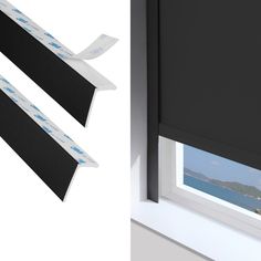 an open window with black roller shades and white trim