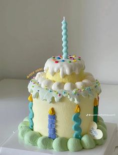 a birthday cake decorated with candles and decorations