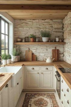 a kitchen with white cabinets and wooden counter tops, an area rug on the floor