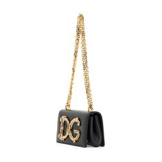 Made in Italy, the Calfskin DG Girls Phone Bag by Dolce & Gabbana features a baroque DG logo in enameled and amber-toned gold-plated ABS on the front. The bag is crafted with calfskin and has an adjustable chain strap, a front flap with the DG logo, and hidden double magnetic fastenings. The bag's lining is also made of calfskin, providing a luxurious touch. Dg Logo, Makeup Travel Case, Travel Makeup, Beauty Accessories, Travel Case, Phone Bag, Chain Strap, Pet Accessories, Bag Sale