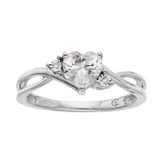 a heart shaped diamond ring with two diamonds on it