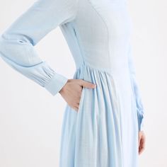 "This Vintage inspired Medieval dress Crafted with soft cotton linen in blue hues, featuring pleated detail on the waist, this Long sleeve maxi dress will give you a perfect silhouette. This is a sophisticated, simple, timeless but also somehow contemporary. Wear this blue dress for your leisurely life. DETAIL * Medium weight cotton linen blend fabric (50% Linen, 50% Cotton) * Two side seam pockets * Long Lantern sleeve * Right side zipper * Pleat detailed waist * Ankle length * Perfect for both Blue Linen Long Sleeve Maxi Dress, Fitted Modest Cotton Maxi Dress, Fitted Blue Linen Dress For Daywear, Light Blue Cotton A-line Midi Dress, Blue Cotton A-line Maxi Dress, Blue A-line Cotton Maxi Dress, Blue Linen A-line Maxi Dress, Modest Maxi Length Cotton Dress, Modest Maxi Cotton Dress