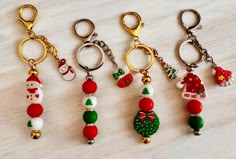 four christmas themed key chains on a table