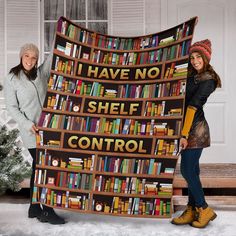 two women standing next to each other holding up a book shelf quilt that says i have no shelf control