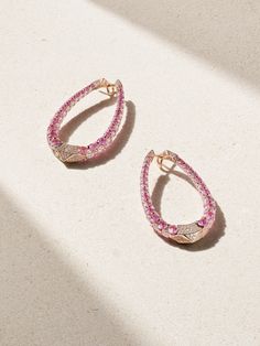 Boghossian's earrings are crafted using the house's 'Merveilles' technique, which makes the settings nearly invisible, allowing the stones to sparkle beautifully. Cast from 18-karat rose gold, they have an elongated hoop silhouette encrusted with 11.16-carats of pink sapphires and 9.38-carats of shimmering diamonds. Luxury Pink Diamond Earrings, Luxury Pink Earrings With Brilliant Cut, Luxury Teardrop Earrings With Pave Setting, Luxury Pear-shaped Earrings With Pave Setting, Luxury Pear-shaped Diamond Earrings, Luxury Rose Gold Oval Earrings, Luxury Pierced Diamond Hoop Earrings, Luxury Pink Hoop Earrings, Oval Luxury Earrings