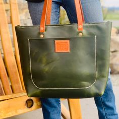 Luxury Green Leather Tote Bag. Panhandle Red's Original Design and Craftsmanship. Panhandle Red Leather Company. 100% Handcrafted Products, Made in Idaho, USA. NAME: THE WESTWOOD GREEN TOTE High Quality Material: Panhandle Red Company is in Post Falls, Idaho. We are a custom leather shop, we build all our leather products by hand. We only use American Full Grain Leathers, they are the best. Designed and Handcrafted by Panhandle Red Full Grain Green Leather Copper Rivets Inside and Outside Pockets Zipper Closure Perfect for Laptop or Professional Needs Approximate Measurements: 14 High x 18 Wide x 3 Inch Bottom Made in Idaho, USA Green Leather-lined Tote Shoulder Bag, Green Waxed Finish Tote Shoulder Bag, Dark Green Leather Shoulder Bag In Rectangular Shape, Green Rectangular Leather-lined Bag, Dark Green Rectangular Leather Shoulder Bag, Green Rectangular Bag With Waxed Finish, Rectangular Dark Green Leather Shoulder Bag, Dark Green Leather Bags For Daily Use, Olive Rectangular Shoulder Bag With Leather Handles