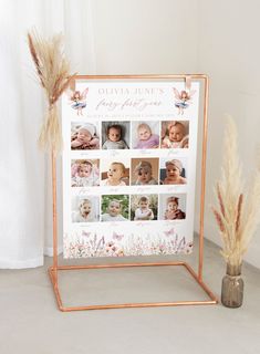 a baby's first year photo is displayed in front of a vase with dried grass