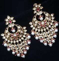 Kundan Ruby Pearl Chandbali/ Jadau Kundan Earrings/Sabyasachi Earrings/ Indian Chandbali/ Indian Kundan Dangle Earrings/ Pakistani Jewelry Features: Made in Brass with very high quality Kundan Stones and Pearls Handcrafted To Perfection Light Weight Earrings A Beautiful & Memorable Gift for Weddings and Special Occasions Dimensions: Earrings: Approx.3 inches Comes with push back closure Ready to ship from VA, USA Traditional White Pearl Earrings For Reception, White Bollywood Earrings For Reception, Bollywood White Earrings For Reception, Bollywood Style White Earrings For Reception, White Earrings For Reception And Festivals, Traditional Pearl Latkans Earrings For Reception, Traditional White Earrings For Reception, Traditional Danglers With Latkans For Reception, White Chandbali Danglers For Reception