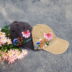 "Floral Buzz" Embroidered Baseball Cap with Daisies and Bees Welcome to the sophisticated world of "Floral Buzz" - a baseball cap embroidered with daisies and bees, where femininity meets the vibrancy of nature. Each hat is a handcrafted masterpiece, with delicate chrysanthemums and vivid bee images, creating a perfect combination of style and nature. Material: The hat is made from high quality fabric, ensuring comfort and breathability in all situations. Style and Design: Can be adjusted to fit Multicolor Cap With Embroidered Logo, Multicolor Embroidered Logo Cap, Multicolor Embroidered Snapback Baseball Cap, Multicolor Embroidered Curved Brim Hat, Embroidered Baseball Cap One Size Fits Most, Embroidered Multicolor Cap, Adjustable Cap With Multicolor Embroidery, Multicolor Embroidered Cap, Adjustable Embroidered Brimmed Baseball Cap