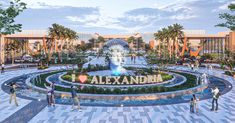 people are standing in front of a fountain with the word i love alexandria on it